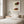 Strawberry Lady art in a white frame in a serene bedroom