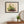 Strawberry Patch wildflower landscape wall art print in a black frame hanging in an entryway