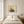 Strawberry Patch wildflower landscape wall art print in a red oak wood frame hanging in a bedroom
