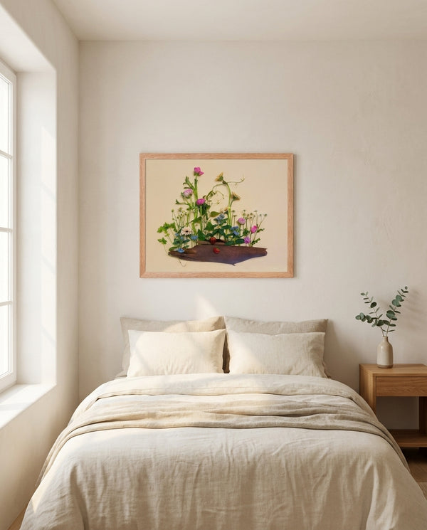 Strawberry Patch wildflower landscape wall art print in a red oak wood frame hanging in a bedroom