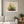 Strawberry Patch wildflower landscape wall art print in a white frame hanging in a living room