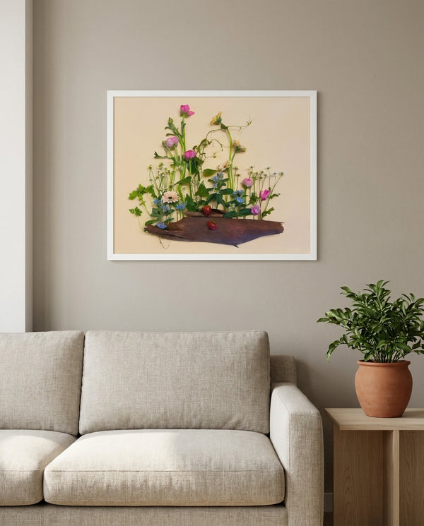 Strawberry Patch wildflower landscape wall art print in a white frame hanging in a living room