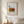Summer Harvest Box botanical harvest still life wall art print in a red oak wood frame hanging in a bedroom