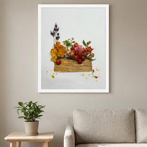Summer Harvest Box botanical harvest still life wall art print in a white frame hanging in a living room