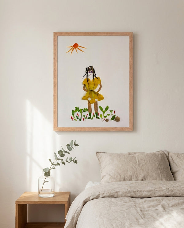 Summer Sun Girl whimsical feminine figure wall art print in a red oak wood frame hanging in a bedroom