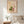Sunlit Windowsill botanical garden window wall art print in a red oak wood frame hanging in a bedroom