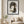 Tendril Serenity natural seed pod portrait wall art print in a black frame hanging in a living room