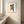 Tree Hug Monkey botanical monkey wall art print in a red oak wood frame hanging in a bathroom