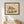 Wandering Rhino botanical wildlife wall art print in a black frame hanging in a kids room