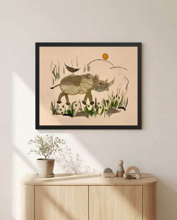 Wandering Rhino botanical wildlife wall art print in a black frame hanging in a kids room