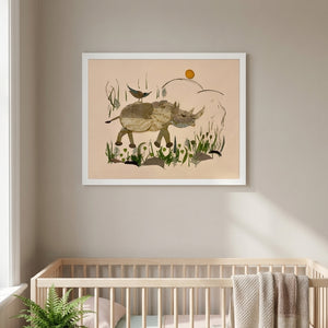 Wandering Rhino botanical wildlife wall art print in a white frame hanging in a nursery