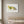 Wild Bloom Fox in a white frame hung above a crib in a nursery