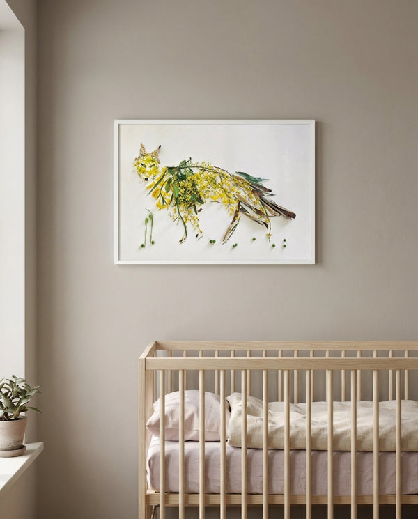 Wild Bloom Fox in a white frame hung above a crib in a nursery