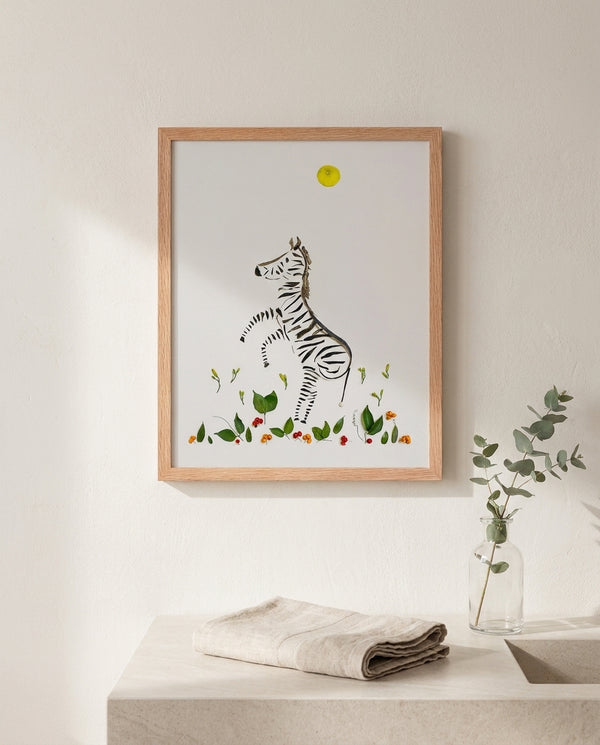 Wild Rising Zebra botanical wildlife wall art print in a red oak wood frame hanging in a bathroom