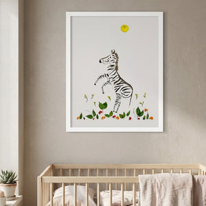 Wild Rising Zebra botanical wildlife wall art print in a white frame hanging in a nursery