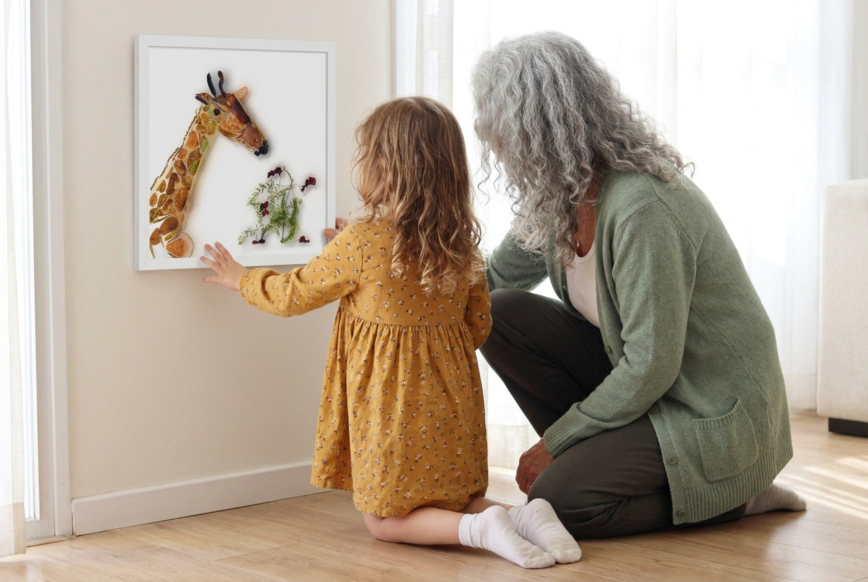 Artist Shirley Regev and her granddaughter looking at the Gentle Giraffe botanical art