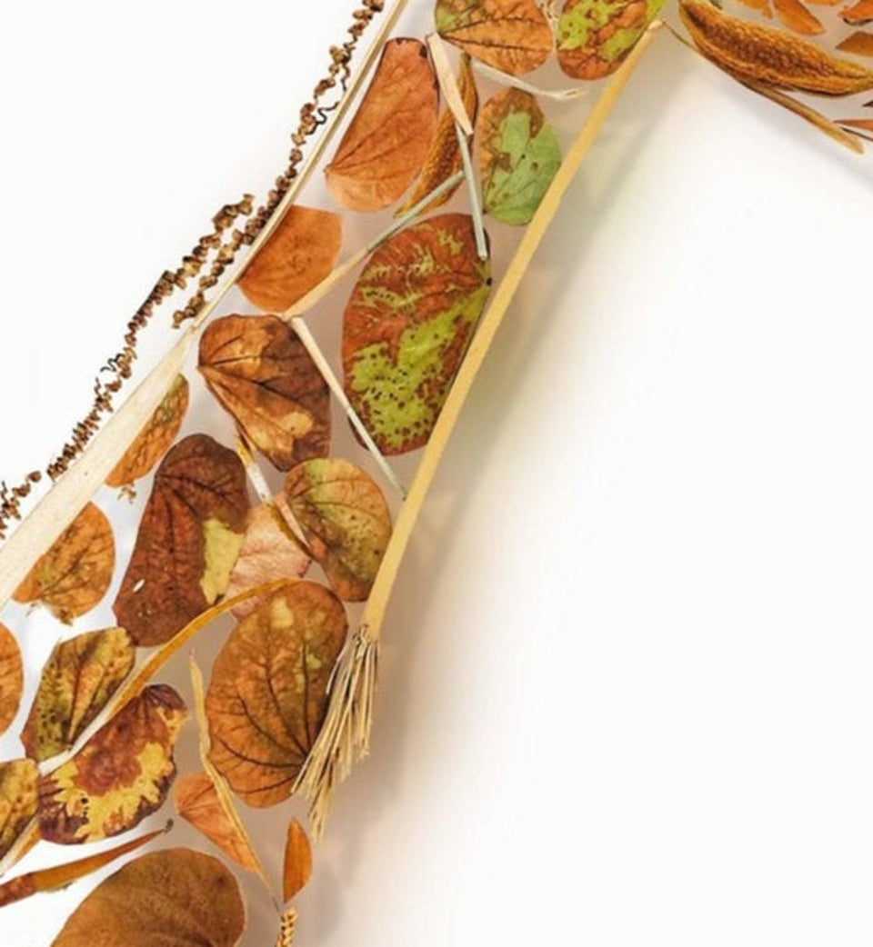Macro detail of real leaves and petals forming the animal coat in FloraFusion botanical wall art