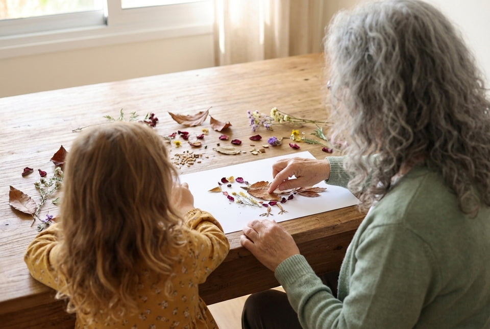 Arranging collected leaves and petals into a little bird together