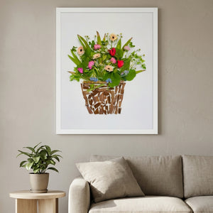 Woodland Flower Basket botanical still life wall art print in a white frame hanging in a living room